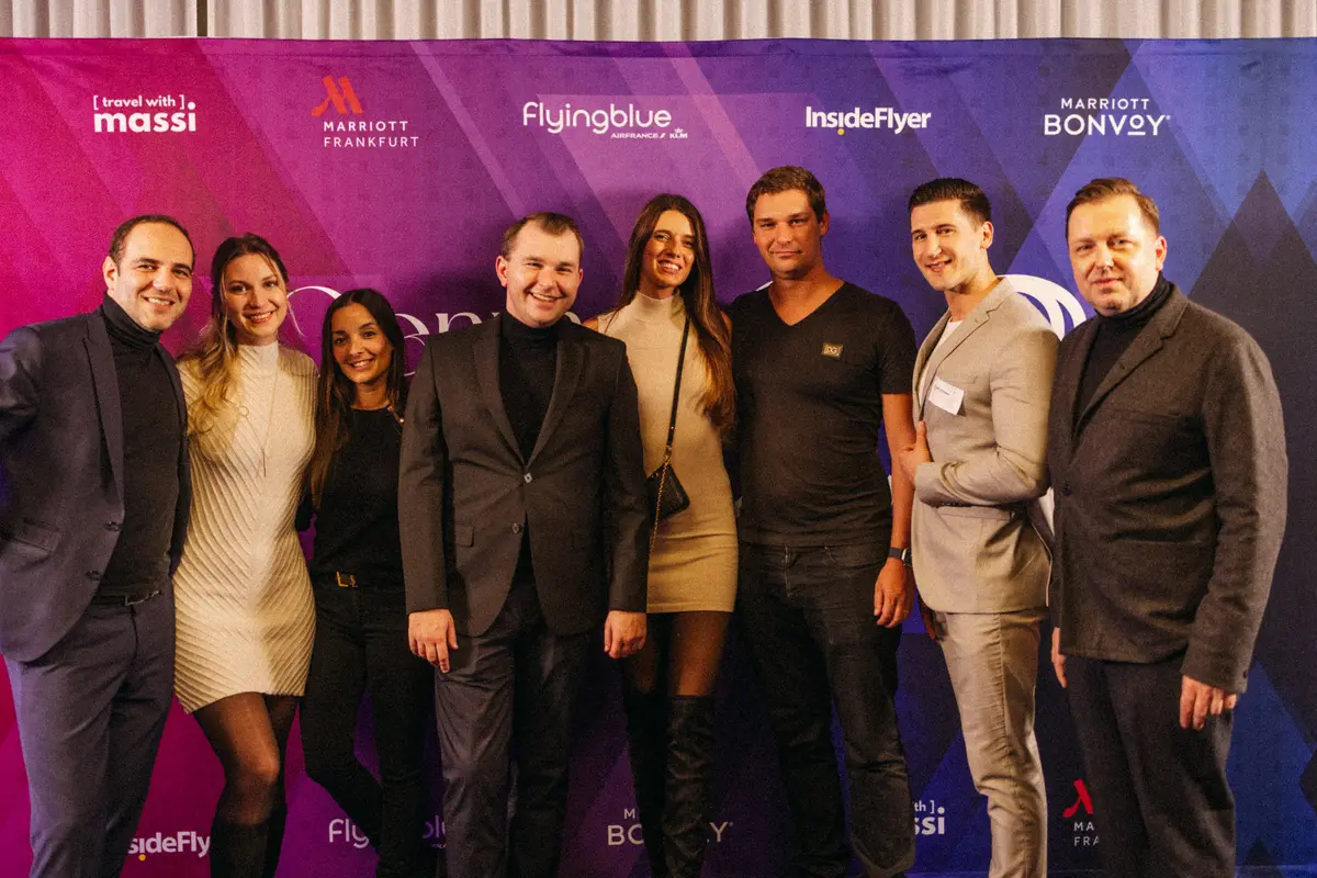 Group photo of guests in front of the awards wall