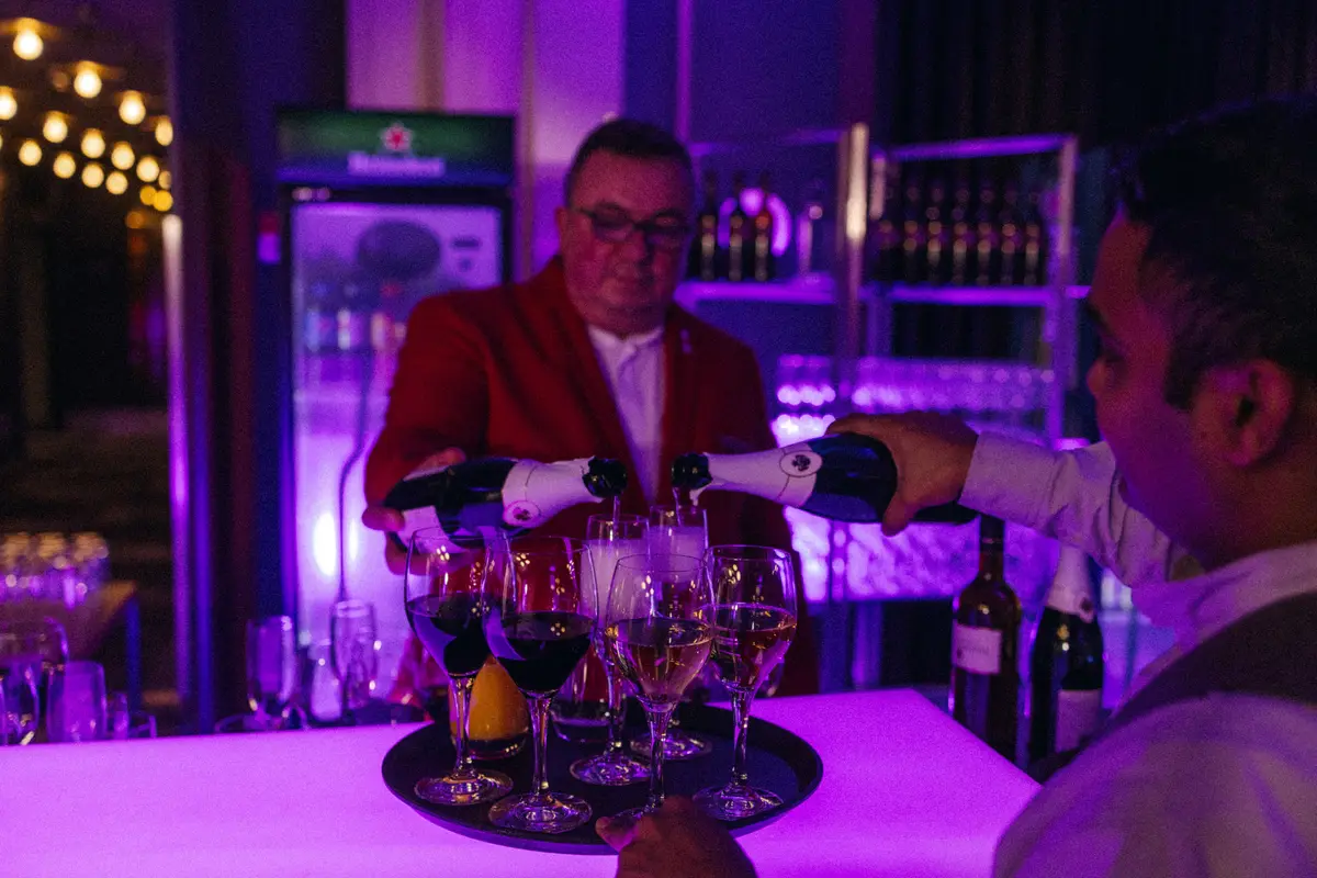 Bar with drinks in violet light
